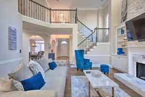 a living room with a couch and a fireplace at Updated Mableton Home about 14 Miles to Downtown ATL! in Mableton