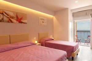 Voodi või voodid majutusasutuse Hotel l'Approdo toas