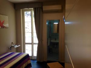 Voodi või voodid majutusasutuse Hotel l'Approdo toas