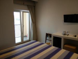 Voodi või voodid majutusasutuse Hotel l'Approdo toas
