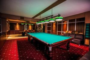 a billiard room with a pool table in it at Гостиница Уфа-Астория in Ufa