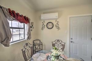 a dining room with a table and chairs and a window at Quaint Roswell Retreat about 1 Mi to Main Street! in Roswell