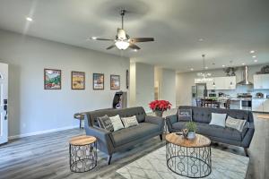 a living room with two couches and a kitchen at Stunning Clovis Home about 1 Mile to Old Town! in Clovis