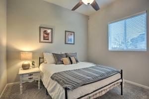 a bedroom with a bed and a window at Stunning Clovis Home about 1 Mile to Old Town! in Clovis