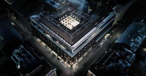 an overhead view of a building with lights on at Clarion Hotel Mestari in Helsinki