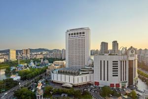 an aerial view of a tall building in a city at Lotte Hotel World in Seoul