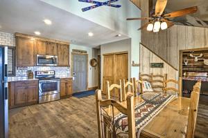 a kitchen with a table and chairs and a ceiling fan at Ski-InandSki-Out Granby Ranch Retreat with Mtn View! in Granby