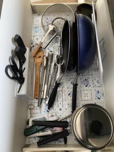 a drawer filled with cooking utensils on a table at 富士晴 Guest House in Minamitsuru