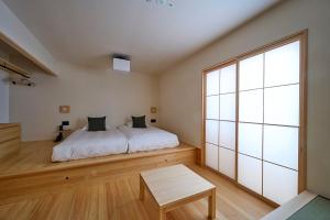 Llit o llits en una habitació de yubune