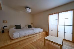 Llit o llits en una habitació de yubune