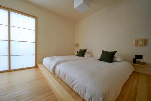 Llit o llits en una habitació de yubune