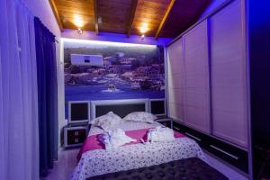 A bed or beds in a room at All Saints Villas