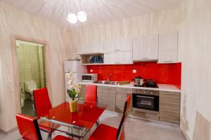 A kitchen or kitchenette at All Saints Villas