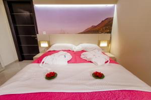 A bed or beds in a room at All Saints Villas
