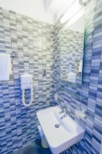 A bathroom at All Saints Villas