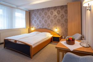 Postel nebo postele na pokoji v ubytování Gruppenhaus St Andreasberg Braunlage Harz