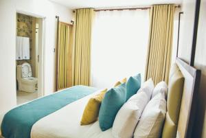 Voodi või voodid majutusasutuse The Warwick Hotel, Nanyuki Kenya toas