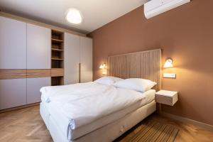 Postel nebo postele na pokoji v ubytování JzP Residence