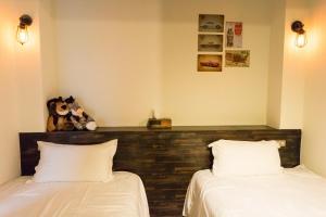Postel nebo postele na pokoji v ubytování Ting Shuan B B&B