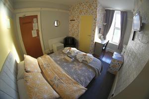 a hotel room with a bed with bows on it at The Eastleigh in Skegness