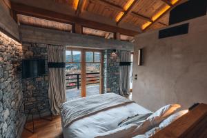 A bed or beds in a room at Chalet Azanias Kalavryta