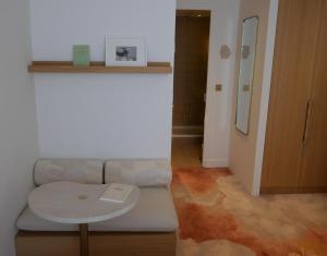 a living room with a couch and a table at Nuage in Paris