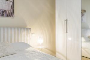 A bed or beds in a room at APPARTAMENTO AL CASTELLO