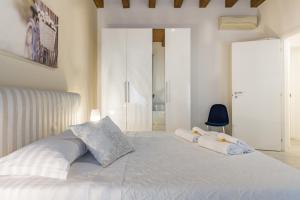 A bed or beds in a room at APPARTAMENTO AL CASTELLO