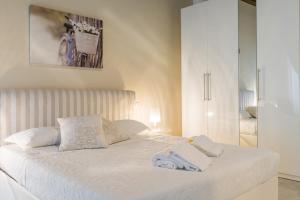 A bed or beds in a room at APPARTAMENTO AL CASTELLO