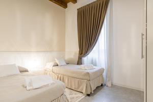 A bed or beds in a room at APPARTAMENTO AL CASTELLO