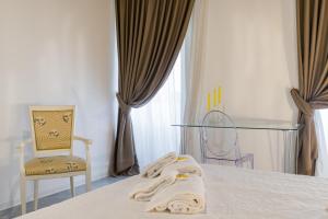 A bed or beds in a room at APPARTAMENTO AL CASTELLO
