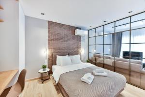 Giường trong phòng chung tại Porto Sea View Apartments