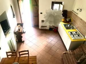 Kuchyň nebo kuchyňský kout v ubytování Appartamenti Il Capomandro