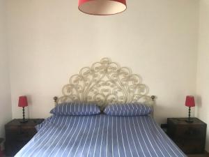 Postel nebo postele na pokoji v ubytování Appartamenti Il Capomandro