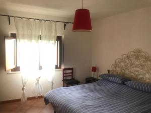Postel nebo postele na pokoji v ubytování Appartamenti Il Capomandro