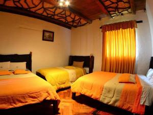 Letto o letti in una camera di Hosteria San Jose de Sigchos