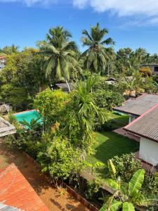 Vue sur la piscine de l'établissement Villa Sea Side Beruwala ou sur une piscine à proximité