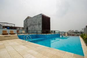 a large swimming pool on top of a building at Golden Tulip The Grandmark Dhaka in Dhaka