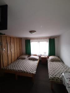Cama o camas de una habitación en Pokoje u Petra