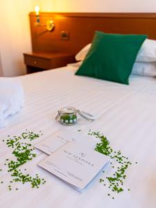 Postel nebo postele na pokoji v ubytování Hotel New Genziana