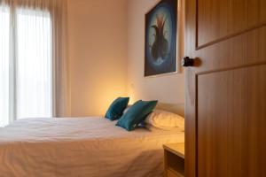 Postel nebo postele na pokoji v ubytování Hotel New Genziana