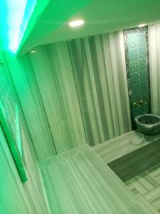 a bathroom with a shower with a sink and a toilet at Grand Park Hotel Spa Beylıkduzu Istanbul in Esenyurt