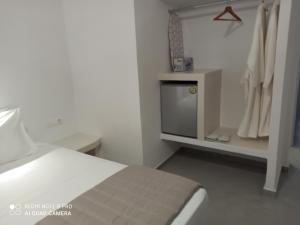 Postel nebo postele na pokoji v ubytování Kleri's apartments 5