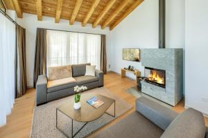 Khu vực ghế ngồi tại Luxury Residence Colosseo Zermatt