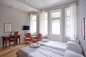 Postel nebo postele na pokoji v ubytování Mössebergs Kurort + 37 fotografií