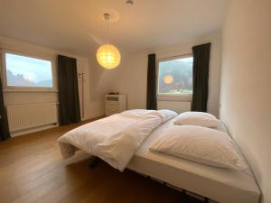 Ένα ή περισσότερα κρεβάτια σε δωμάτιο στο Ferienhaus Waldglück