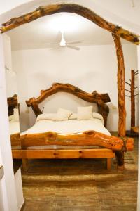 Tempat tidur dalam kamar di Casitas de Norma