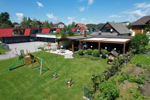 an aerial view of a park with a playground at Ferienwohnungen Petschnig 2 in Drobollach am Faakersee