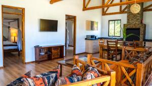 a living room with a couch and a table at Black Wattle House in Nakuru