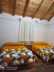 Säng eller sängar i ett rum på Cabañas el Corral del Rayo Huasca